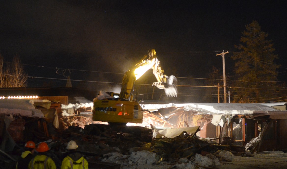 Crews began demolishing the Frank Lloyd Wright Building on Central Avenue Wednesday evening. (Heidi Desch/Whitefish Pilot)