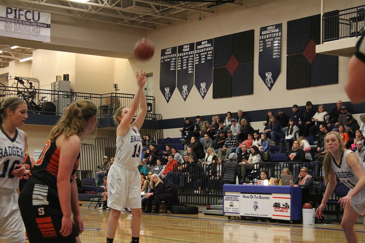 Miranda Wenk focuses as she shoots a free throw, while her teammates prepare for a possible rebound, on Jan. 6 against Priest River.