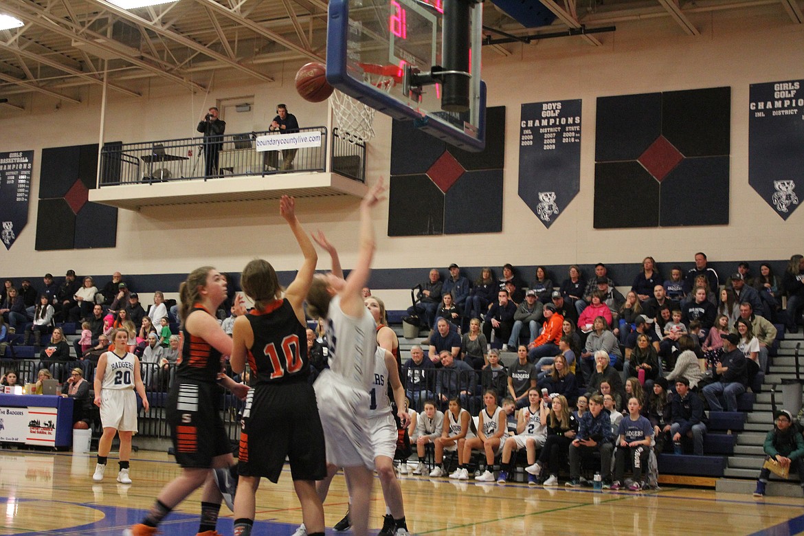 The girls were on their toes fighting for rebounds.