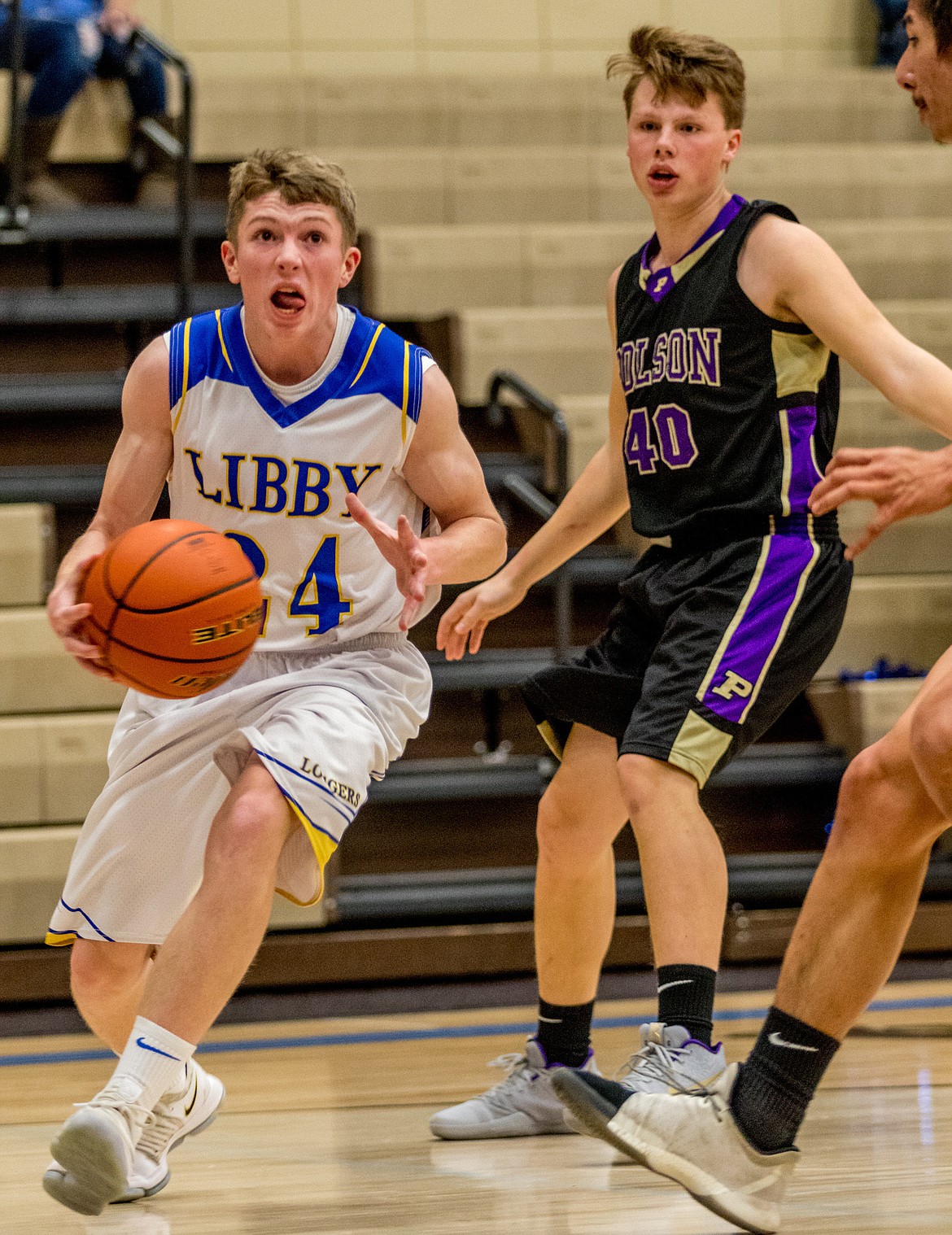 Libby's Jay Beagle sets his sights on the basket seconds before scoring against Polson Saturday. (John Blodgett/The Western News)