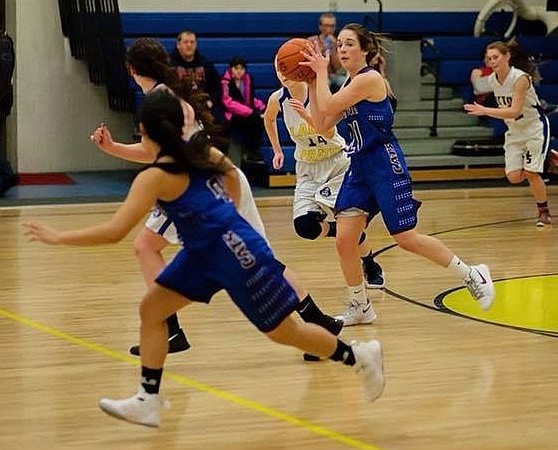 Mountain Cat Madison Mask looks for an opening during a Jan. 5 game against Victor. The Cats won 63-15. (Photo by Jillian Mertz).