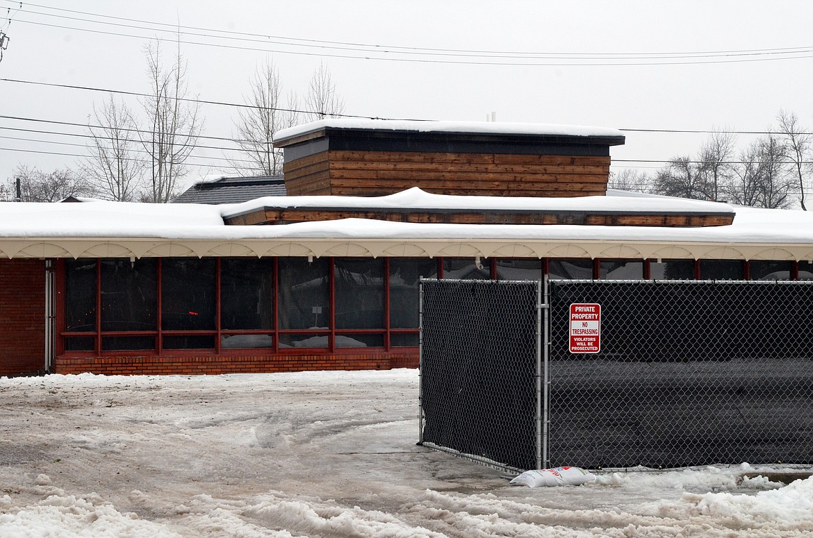 A fence surrounds the Frank Lloyd Wright property Tuesday afternoon on Central Avenue in Whitefish. (Heidi Desch/Whitefish Pilot)