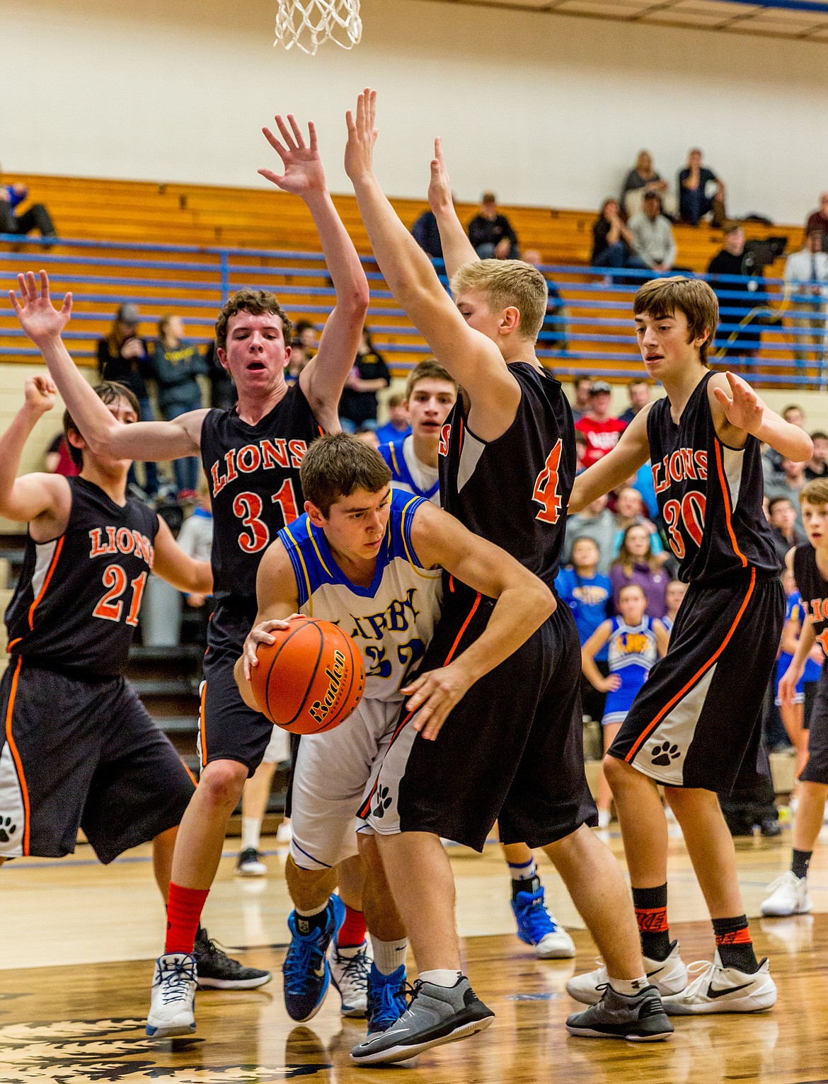 Libby&#146;s Logan Christensen escapes a heavy Eureka defense in Tuesday&#146;s Battle of the Kootenai game.