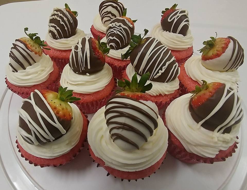 In addition to breakfast, lunch and dinner meals, the Whipped Up Cafe menu includes delicious desserts and breakfast rolls, including these cupcakes topped with chocolate dipped strawberries. (Photo courtesy of Whipped Up Cafe Facebook Page)