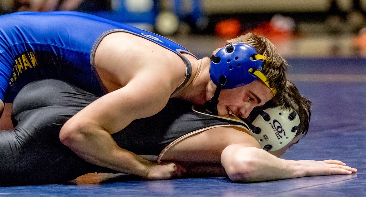 Libby&#146;s Buddy Doolin works to flatten out Eureka&#146;s Gunnar Smith Tuesday in Libby.