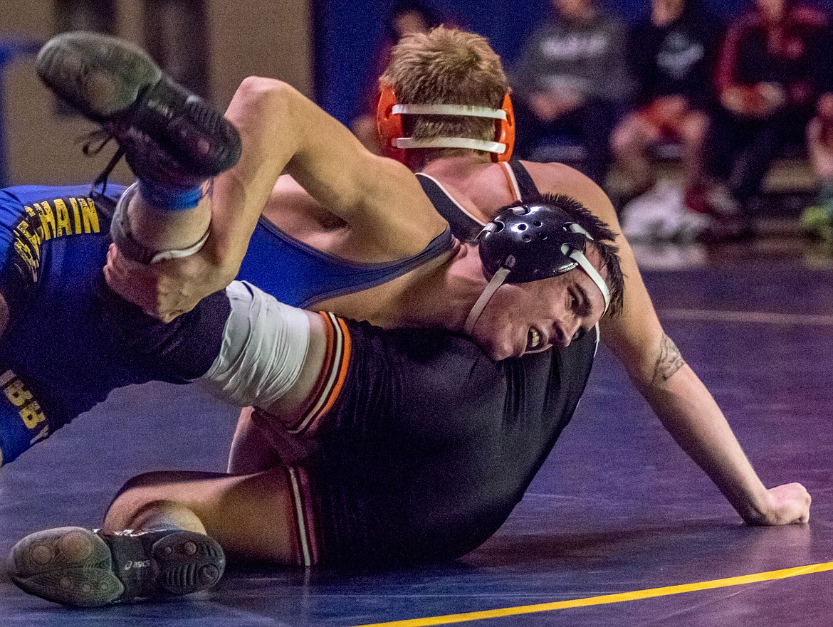 Libby&#146;s Jeff Offenbecher finishes a double leg takedown against Eureka&#146;s Izaac Petz Tuesday. (John Blodgett/The Western News)