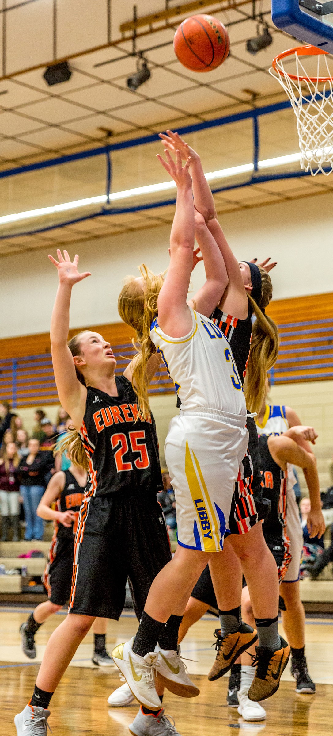 Libby&#146;s Khalyn Hageness is fouled by Eureka&#146;s Maggie Graves in Tuesday&#146;s Battle of the Kootenai game.