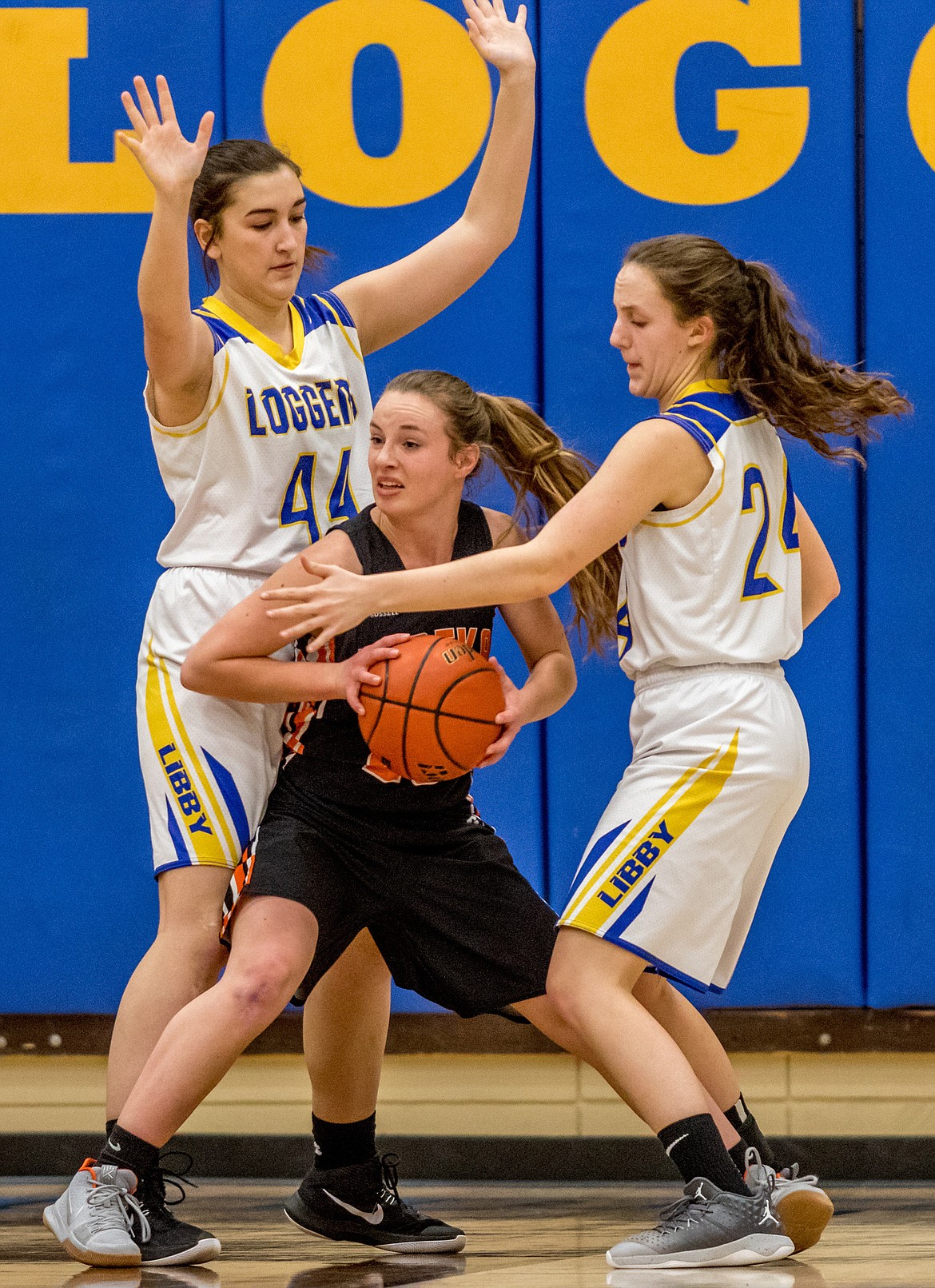 Libby&#146;s Brooklyn Rainer, left and Jayden Winslow, right, defend against Eureka&#146;s Erynn Thier Tuesday.