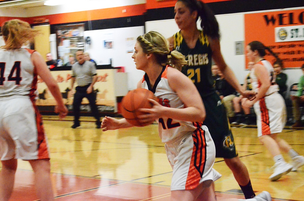 Lindsay Laws (12) takes advantage of an interception to take the ball back to Trotter territory (Erin Jusseaume/ Clark Fork Valley Press)