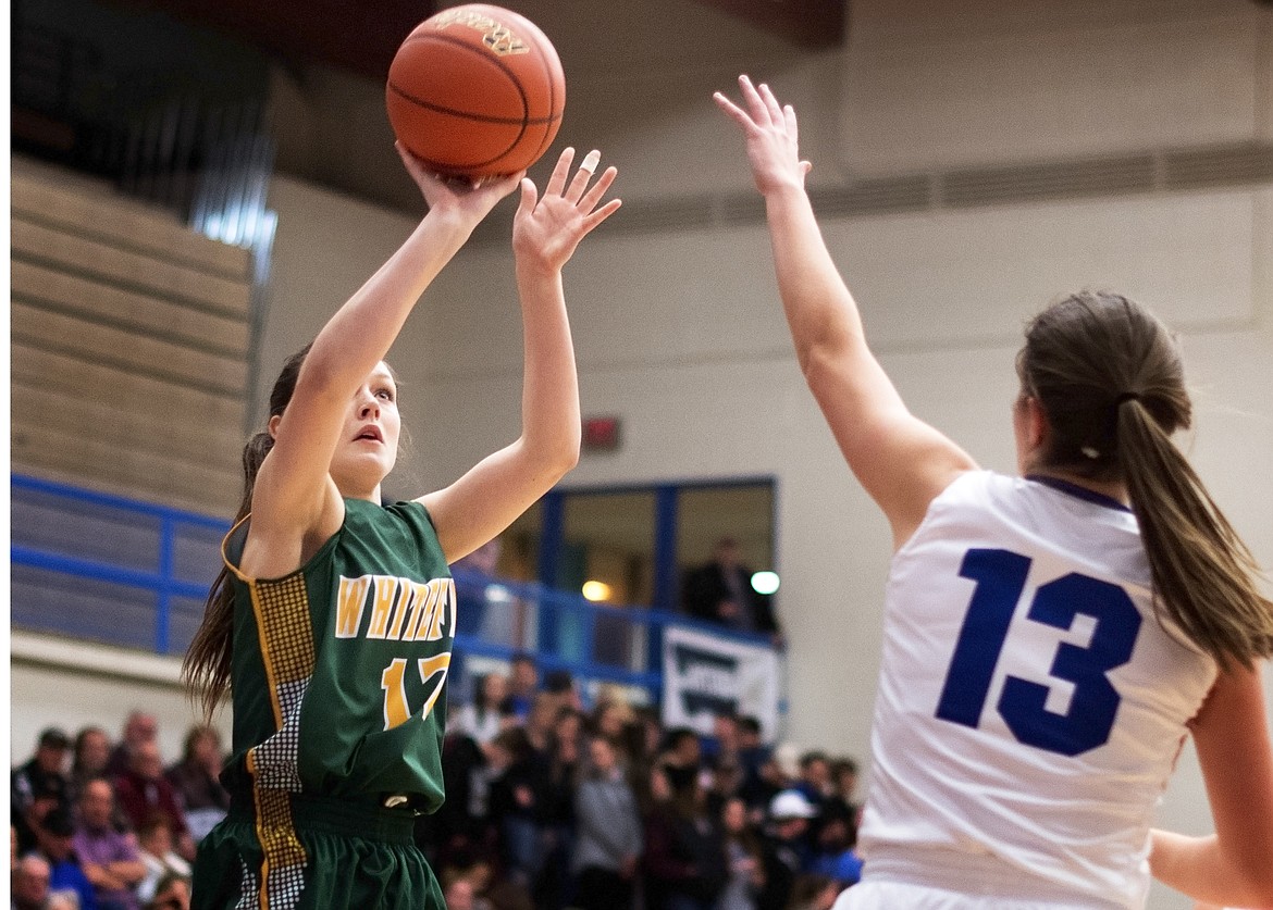 Kyiah Moore launches a jumper Thursday night against Columbia Falls. (Jeremy Weber/Hungry Horse News)