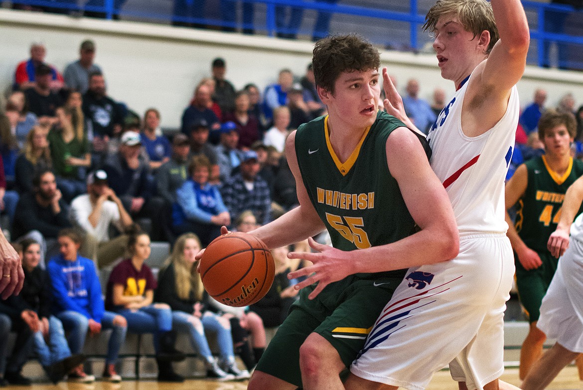 Dillon Botner drop steps to the hoop Thursday night against Columbia Falls. (Jeremy Weber/Hungry Horse News)