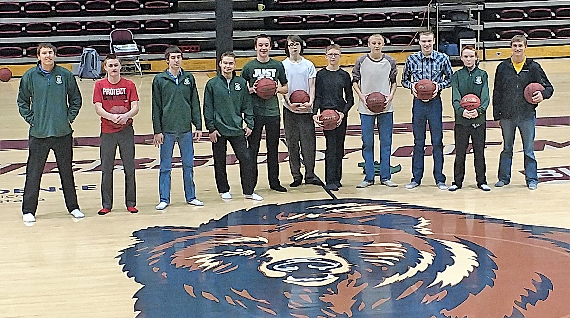 The St. Regis Boys Basketball team attended a UM Grizzly basketball practice on Jan. 3 to learn some of the finer points of the game. From left to right, J.D. Booker, Adam Ball, Ryan Teeter, Ian Farris, Nic Day, Broc Wright, Zane Antos, Andrew Sanford, Jacob Jasper, Tanner Day and assistant coach Tim Yeager. (Photos courtesy of Jesse Allan)