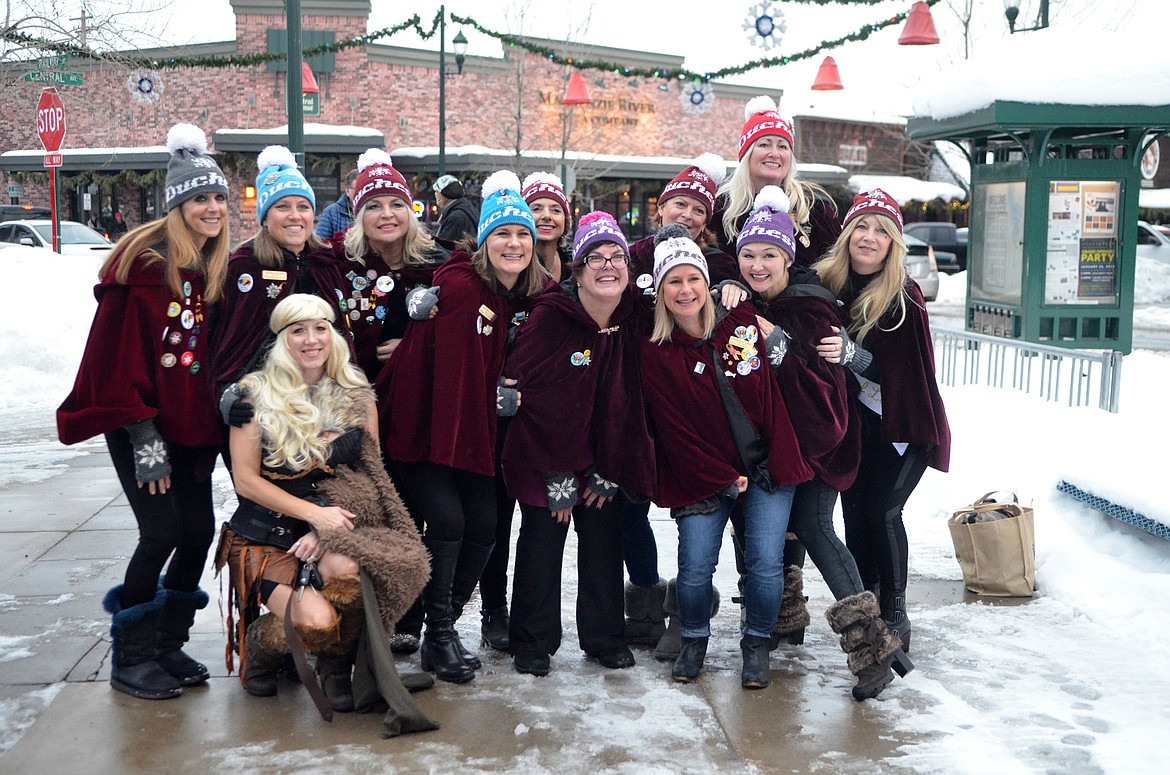 The former Duchesses of Lark pose for a photo Saturday outside the O&#146;Shaughnessy Center before the coronation ceremony for the Carnival king and queen.  (Heidi Desch/Whitefish Pilot)