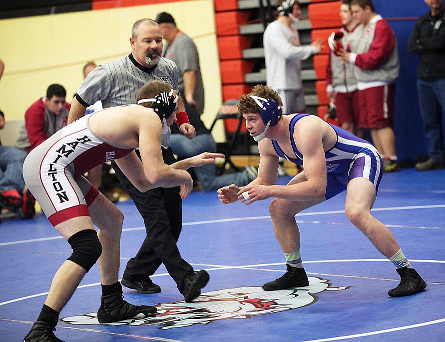 MISSION HIGH School wrestler Gus Bosley grapples with a participant in the Western Montana Duals at the Ronan Events Center. (photo by Susan Lake/Special to the Lake County Leader)