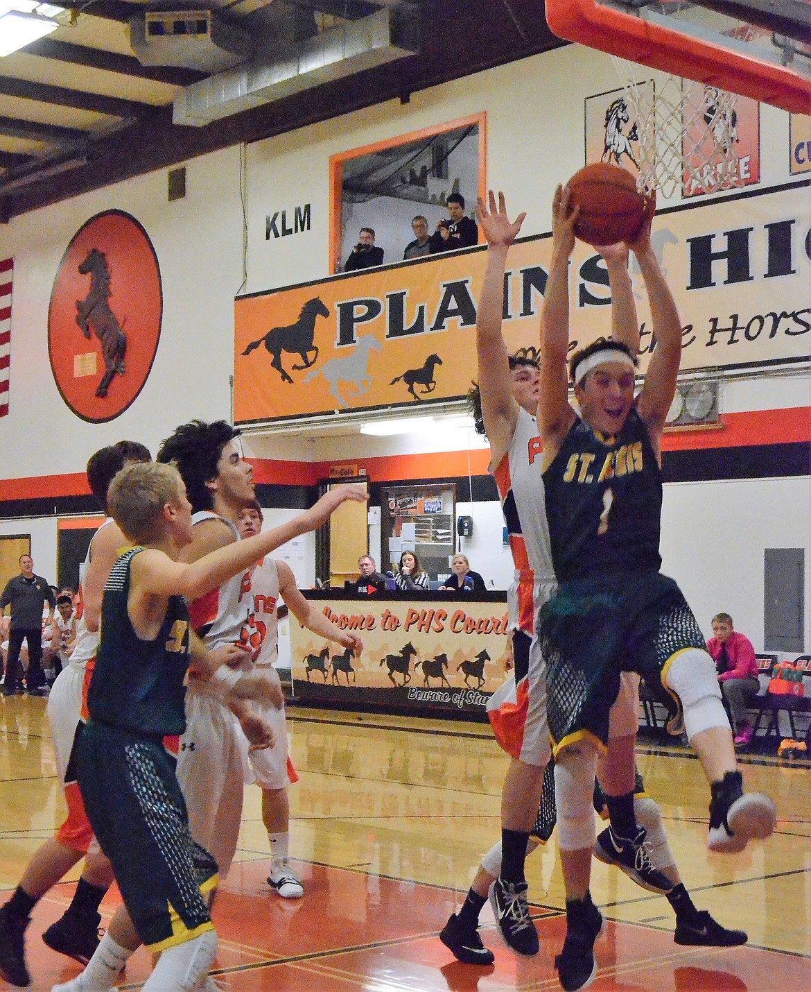 St. Regis sophomore Nic Day jumps for the ball in a Jan. 4 game against Plains. St. Regis boys lost 62-5. (Erin Jusseaume photos/Clark Fork Valley Press)