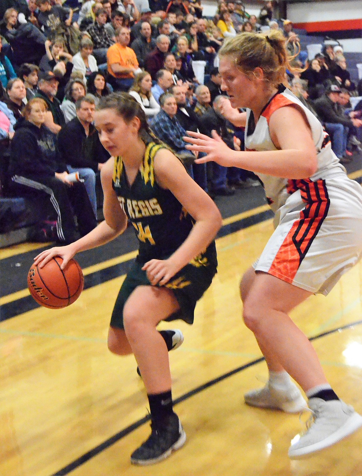 Lady Tiger sophomore Kylee Thompson outsteps a Trotters player during a Jan. 4 game in Plains. St. Regis lost the game 50-48.