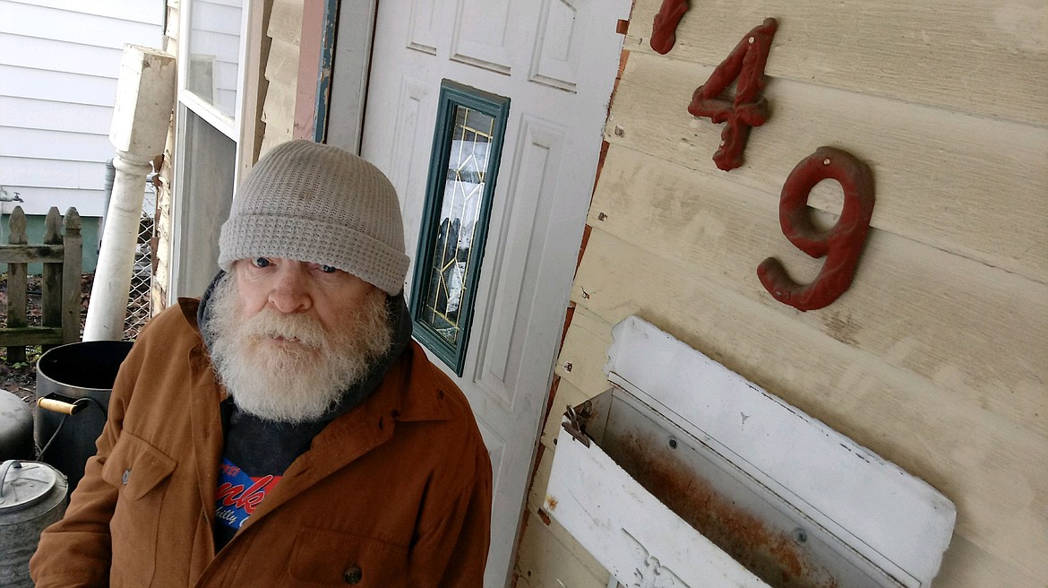 RALPH BARTHOLDT/Press
Terry Pardue stands outside the Third Street home where he lives with his son and grandson. Coeur d&#146;Alene police raided the home around 1 a.m. Thursday.