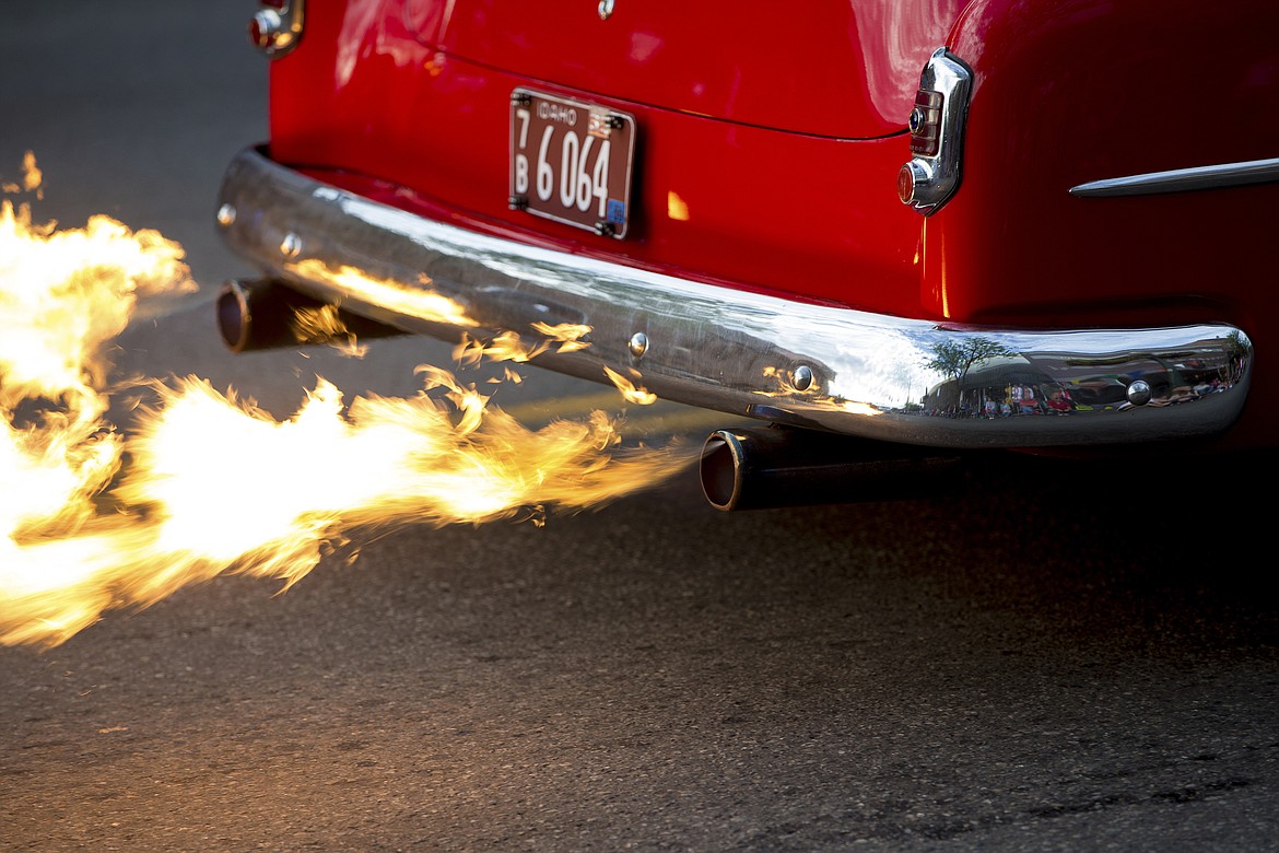 Flames spew out the tailpipes of a 1952 Chevy Deluxe coupe as it roars its way down Sherman Avenue during Car d'Lane 2016. (JAKE PARRISH/Press File)