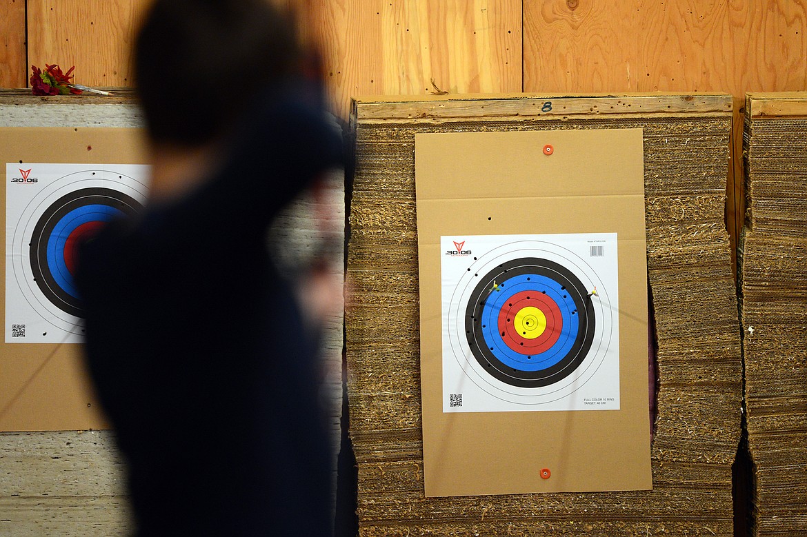 Carter Bechtle, 11, of Whitefish, takes aim during the barebow competition at the Flathead County 4-H Shooting Sports Invitational at the Flathead County Fairgrounds on Saturday. (Casey Kreider/Daily Inter Lake)