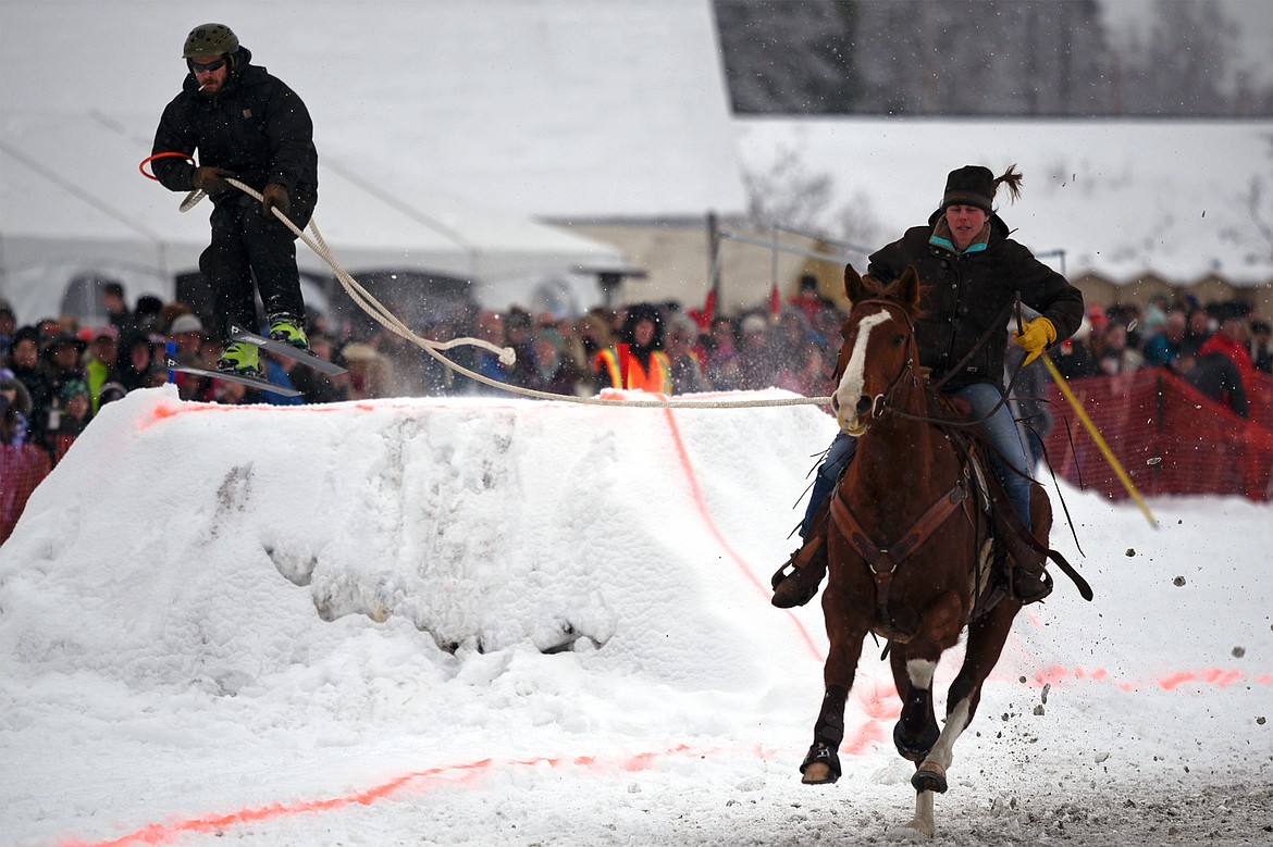 A horse and rider pull a skier through the course at Whitefish Skijoring at Big Mountain Ranch on Saturday. (Casey Kreider/Daily Inter Lake)