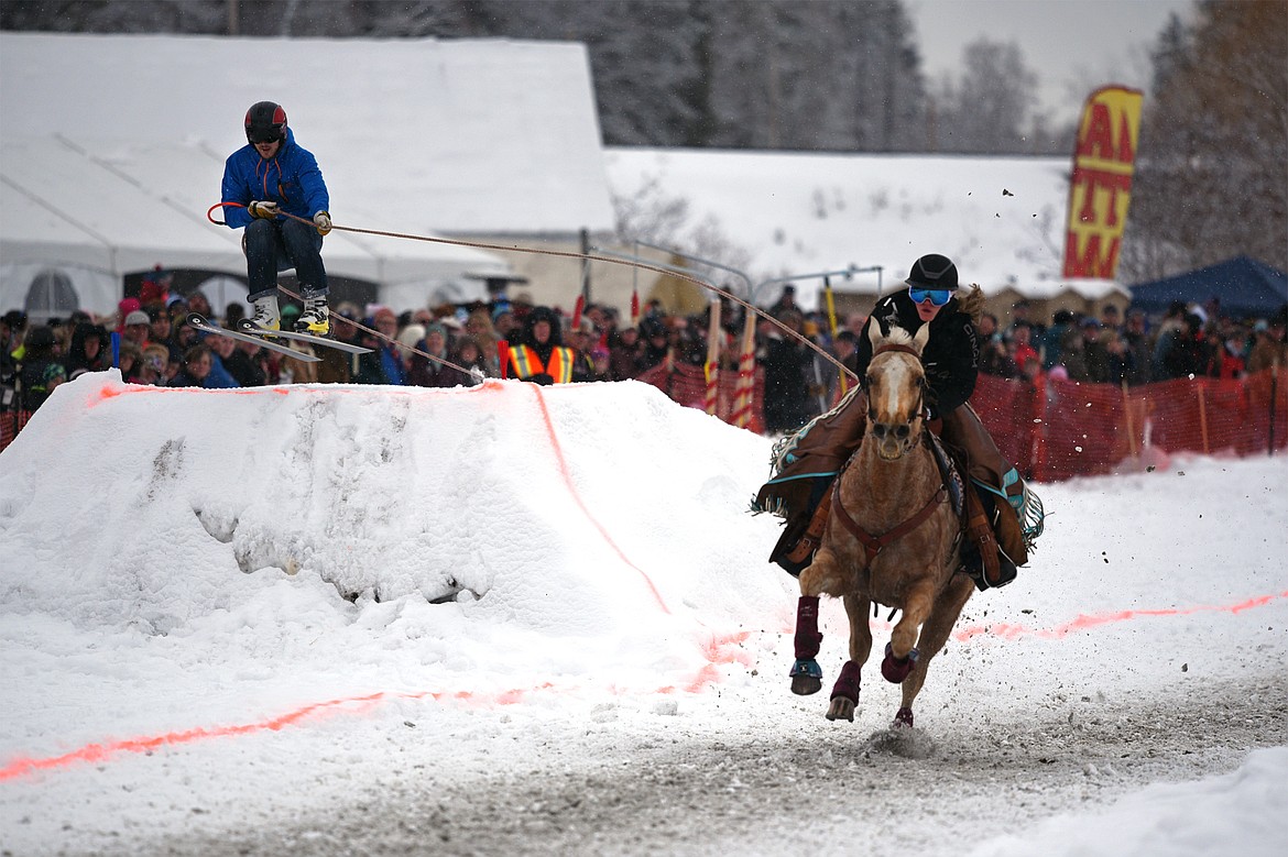 A horse and rider pull a skier through the course at Whitefish Skijoring at Big Mountain Ranch on Saturday. (Casey Kreider/Daily Inter Lake)