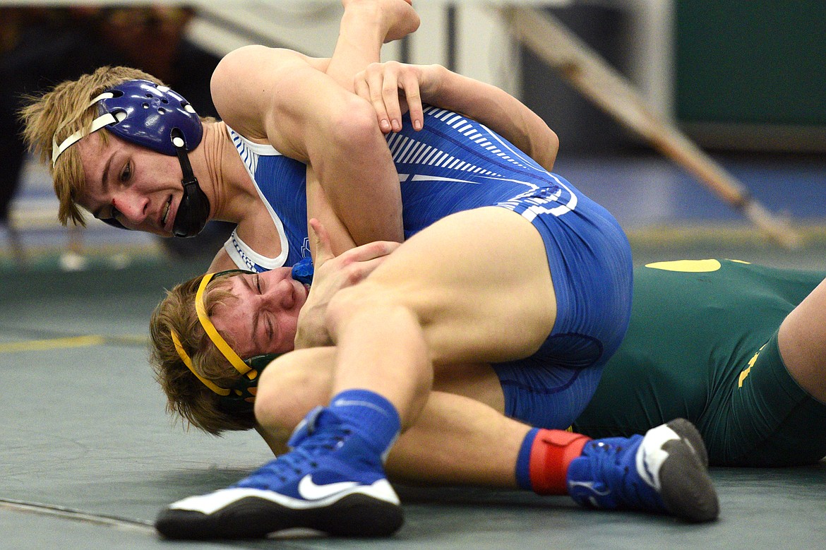 Columbia Falls&#146; Braydon Stone works toward a pin of Whitefish&#146;s Camren Ross at 160 pounds at the Whitefish Duals at Whitefish High School on Friday. (Casey Kreider/Daily Inter Lake)