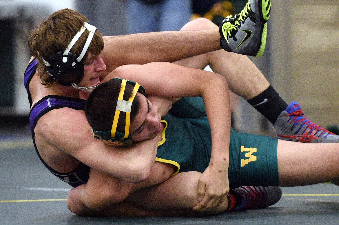 Polson&#146;s Parker Adler works toward a pin of Whitefish&#146;s Robert Bertelsen at 152 pounds at the Whitefish Duals at Whitefish High School on Friday. (Casey Kreider/Daily Inter Lake)