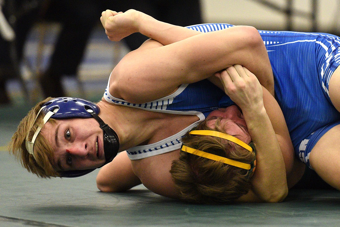 Columbia Falls&#146; Braydon Stone works toward a pin of Whitefish&#146;s Camren Ross at 160 pounds at the Whitefish Duals at Whitefish High School on Friday. (Casey Kreider/Daily Inter Lake)