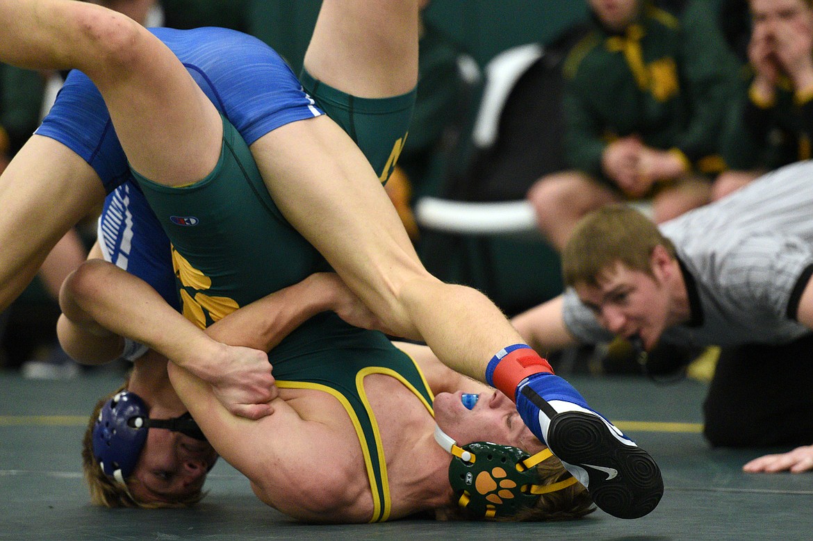 Columbia Falls&#146; Braydon Stone works toward a pin of Whitefish&#146;s Camren Ross at 160 pounds at the Whitefish Duals at Whitefish High School on Friday. (Casey Kreider/Daily Inter Lake)