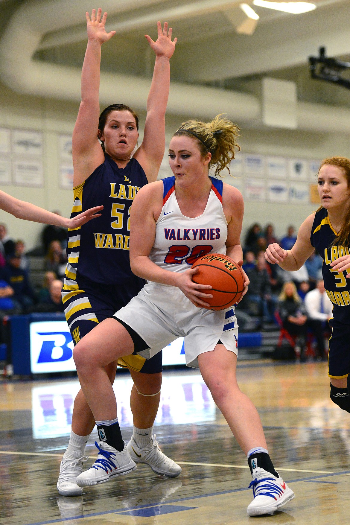 Bigfork&#146;s Jaime Berg works in the post against Deer Lodge&#146;s Ariel Clark. (Casey Kreider/Daily Inter Lake)