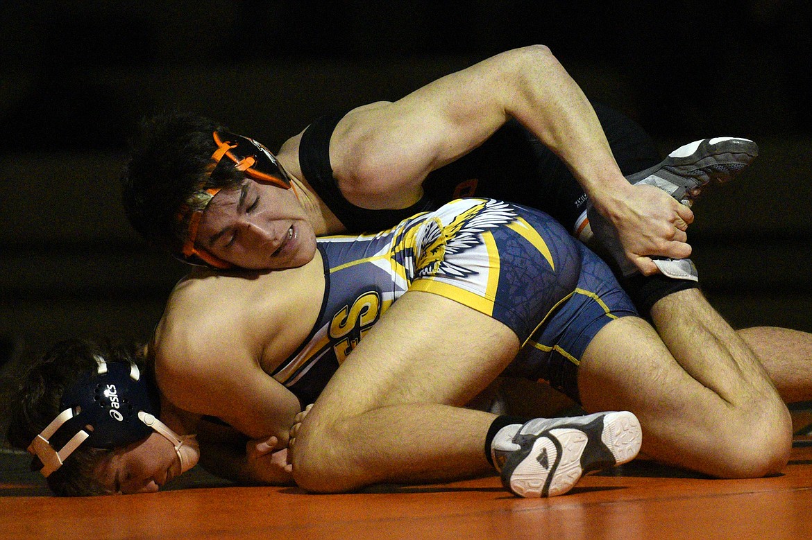 Flathead&#146;s Jaden MacNeil wrestles Missoula Big Sky&#146;s Isaac Skillicorn at 132 pounds at Flathead High School on Thursday. MacNeil won by major decision. (Casey Kreider/Daily Inter Lake)