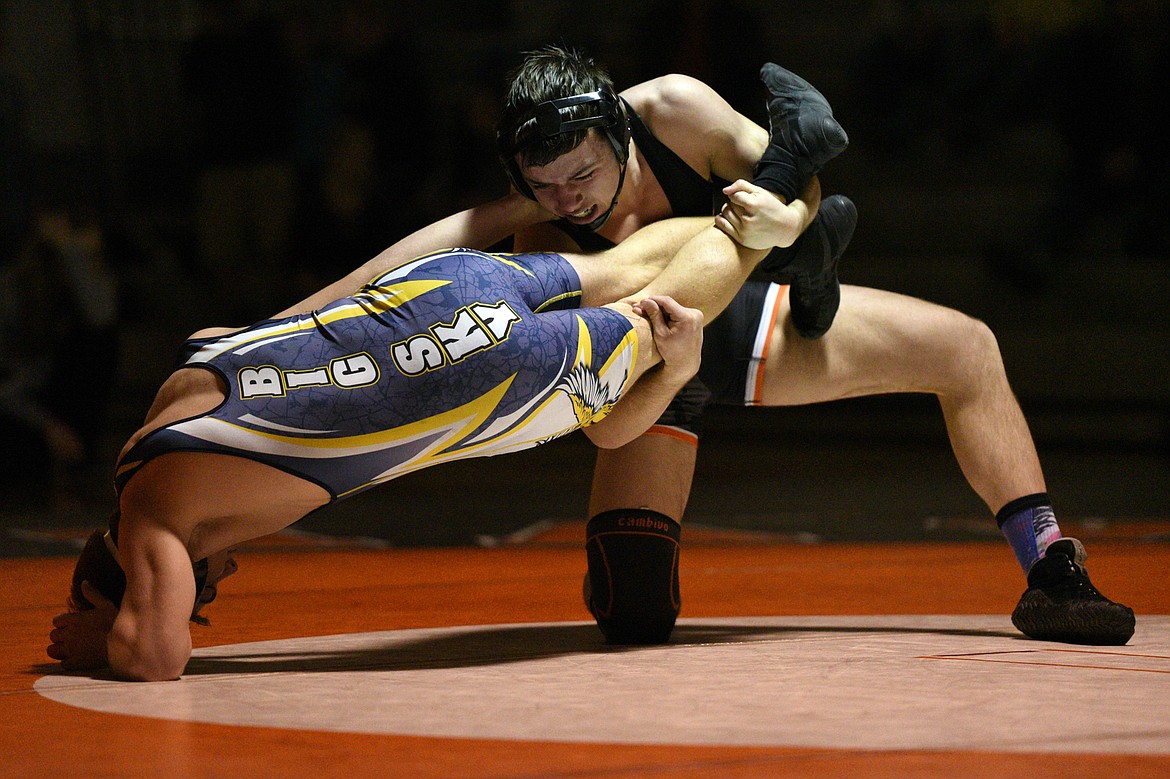 Flathead&#146;s Payton Hume wrestles Missoula Big Sky&#146;s Mason Corcoran at 170 pounds at Flathead High School on Thursday. Hume won by pin. (Casey Kreider/Daily Inter Lake)