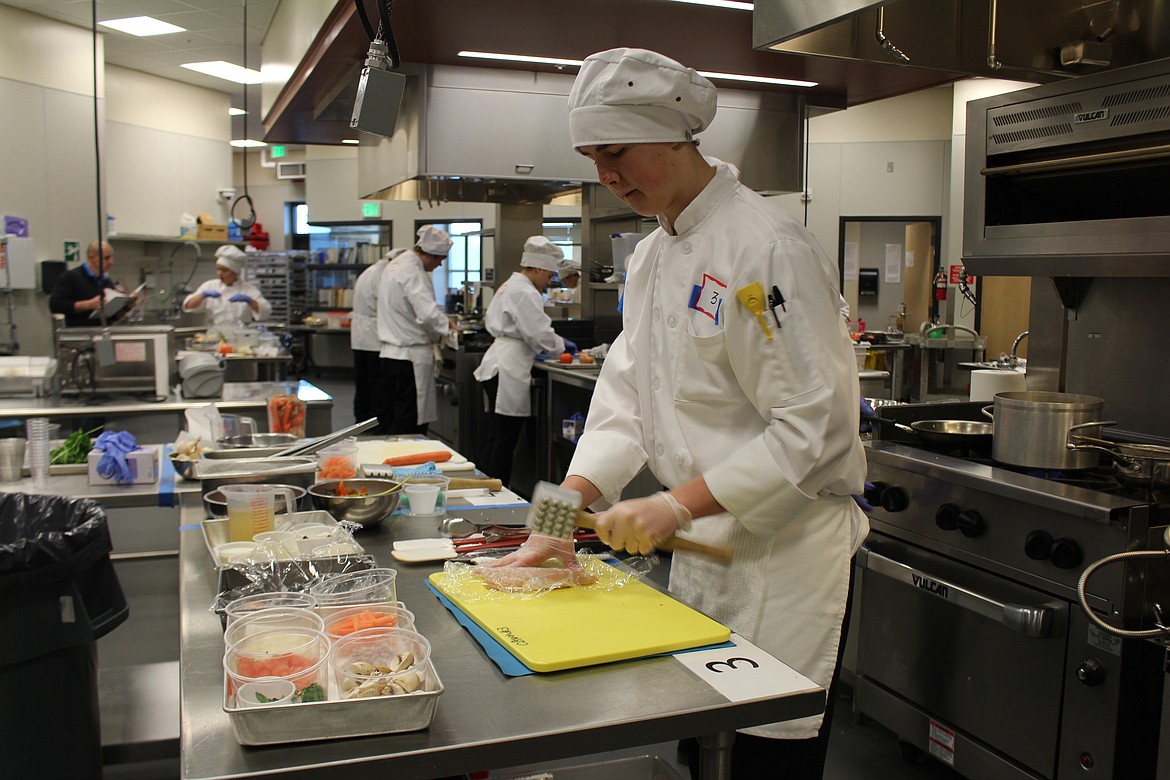 Cheryl Schweizer/Columbia Basin Herald
Jon Judah Vrieling preps the chicken for his entry in Skills USA culinary competition Friday at CB Tech.