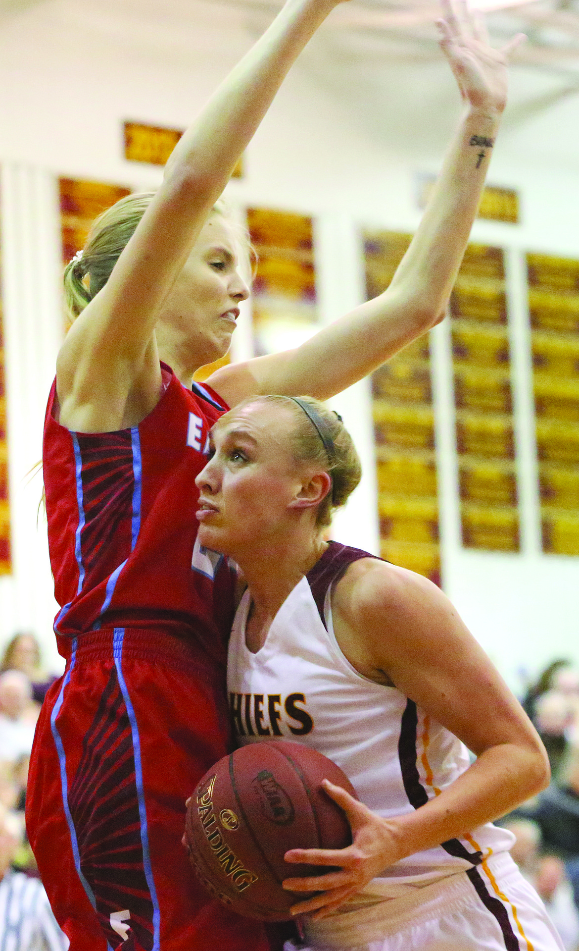 Connor Vanderweyst/Columbia Basin Herald
Moses Lake forward Abby Rathbun (right) tries to find space against Eastmont 6-foot-3 forward Emily Defour.