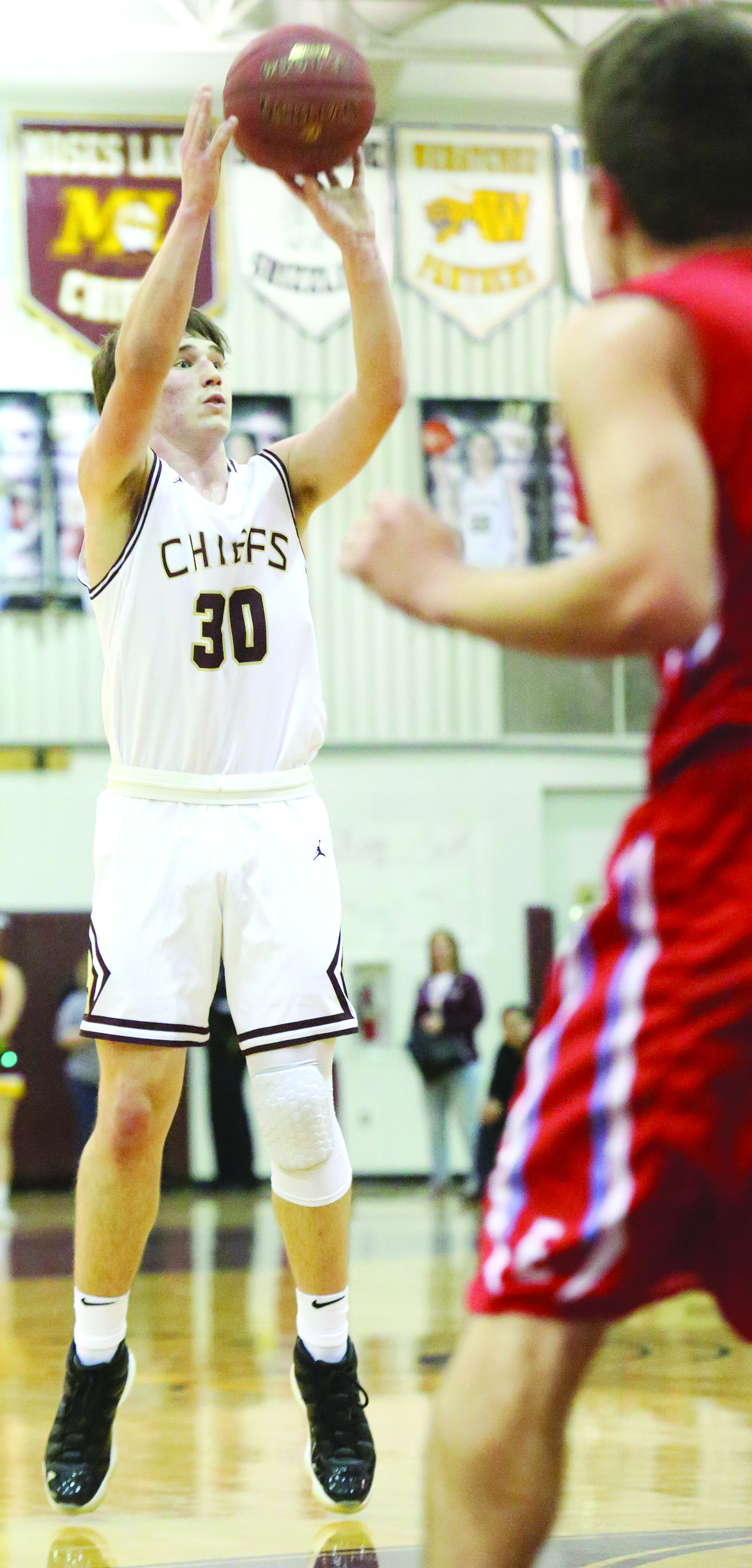 Connor Vanderweyst/Columbia Basin Herald
Moses Lake guard Dax Lindgren takes a shot against Eastmont.