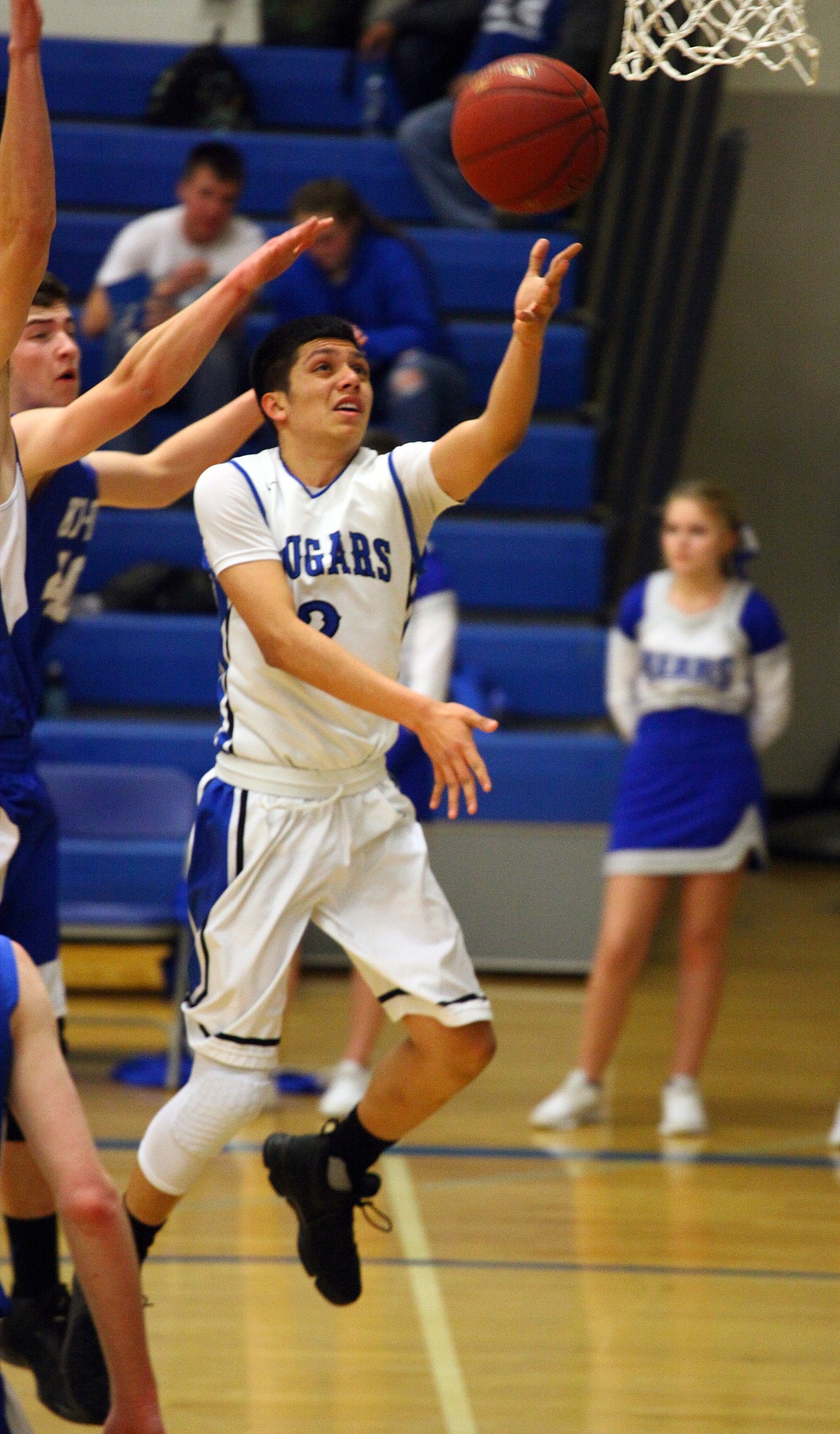 Rodney Harwood/Columbia Basin HeraldWarden guard Jesus Mercado (2) drives the lane against Kiona-Benton defenders during Friday night's game in Warden.