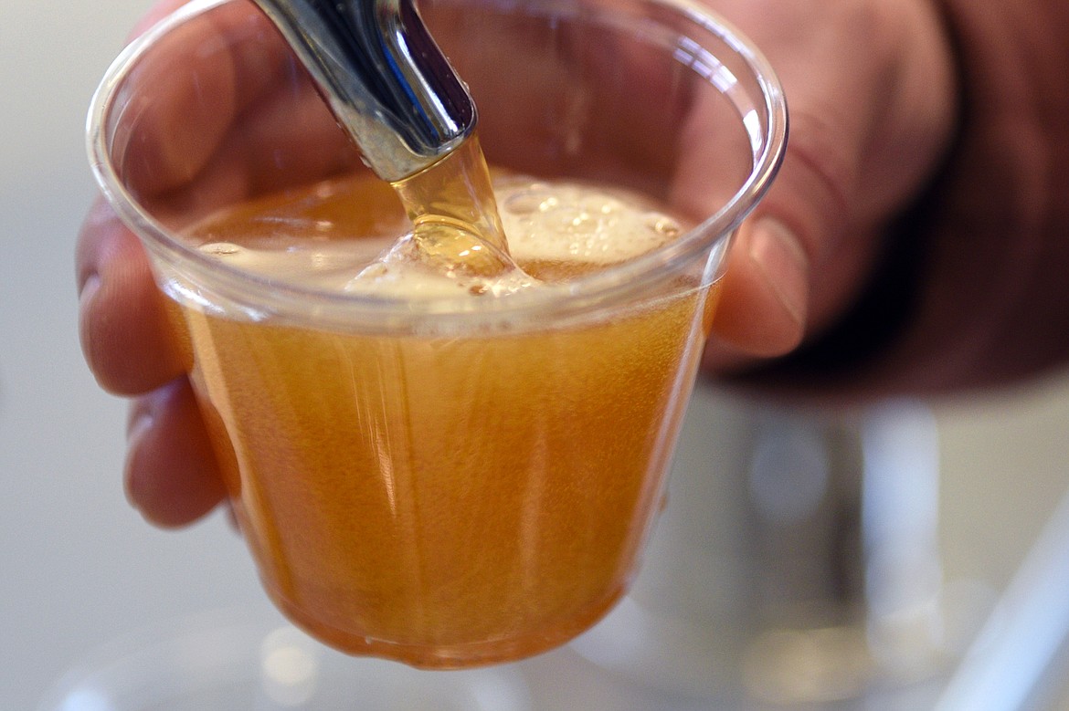 Joe Byers pours a sample of Timber IPA.