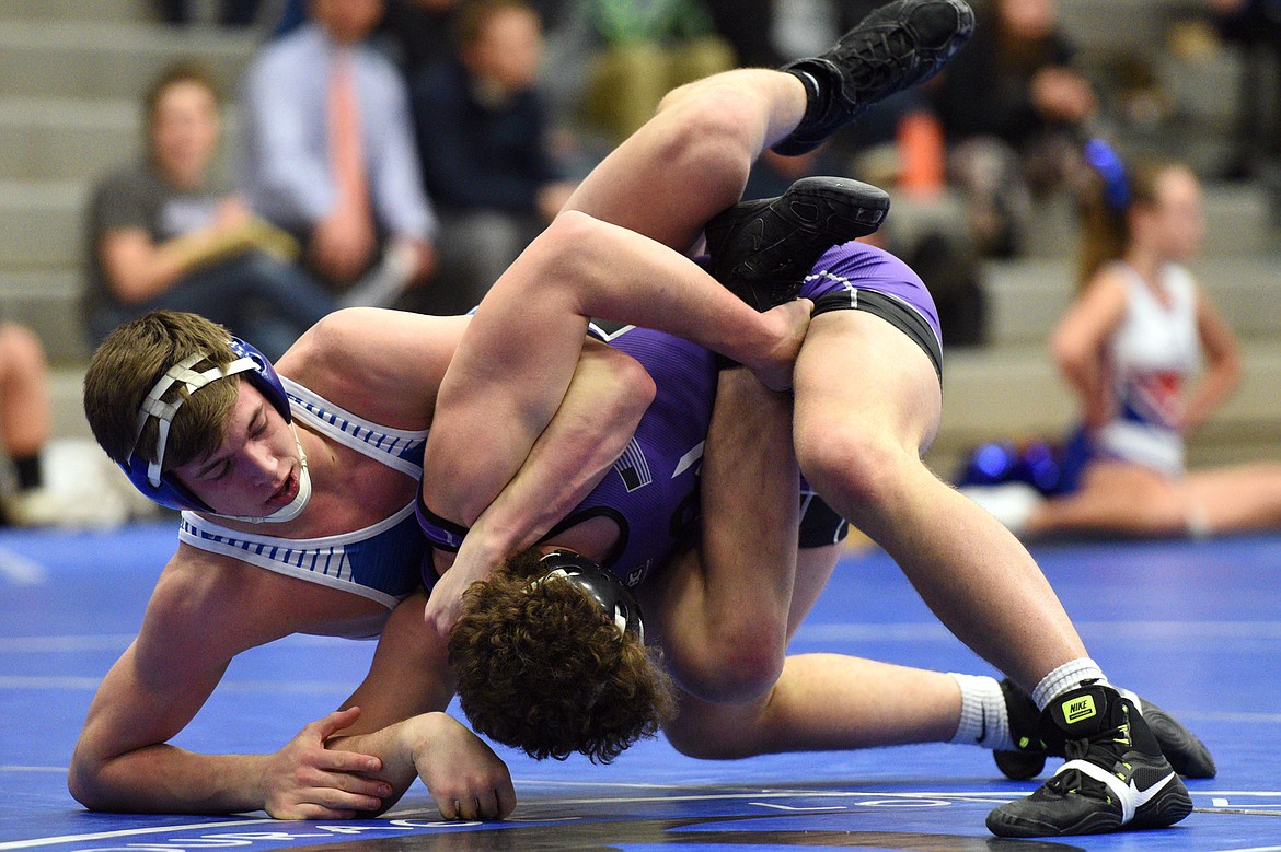 Columbia Falls&#146; Ben Windauer works toward a pin against Polson&#146;s Hunter Fritsch at 170 pounds on Tuesday. (Casey Kreider/Daily Inter Lake)