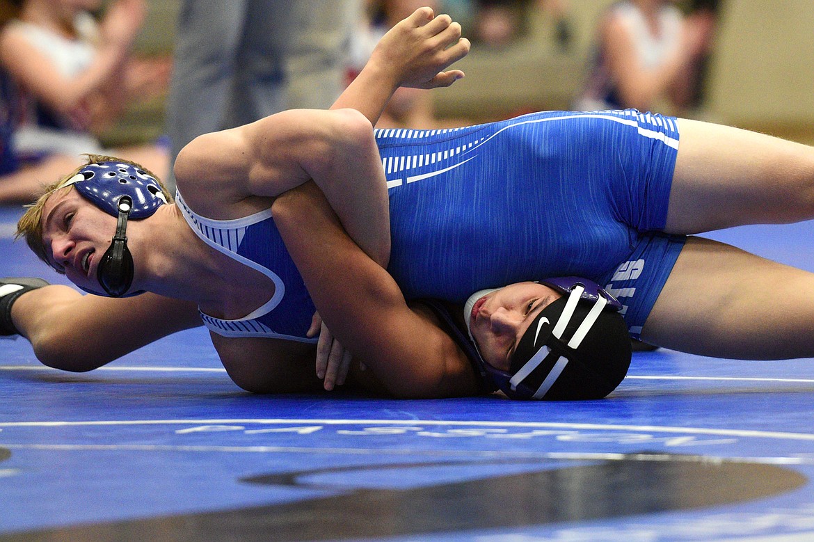 Columbia Falls&#146; Braydon Stone works toward a pin of Polson&#146;s Caleb Pierre at 160 pounds on Tuesday. (Casey Kreider/Daily Inter Lake)