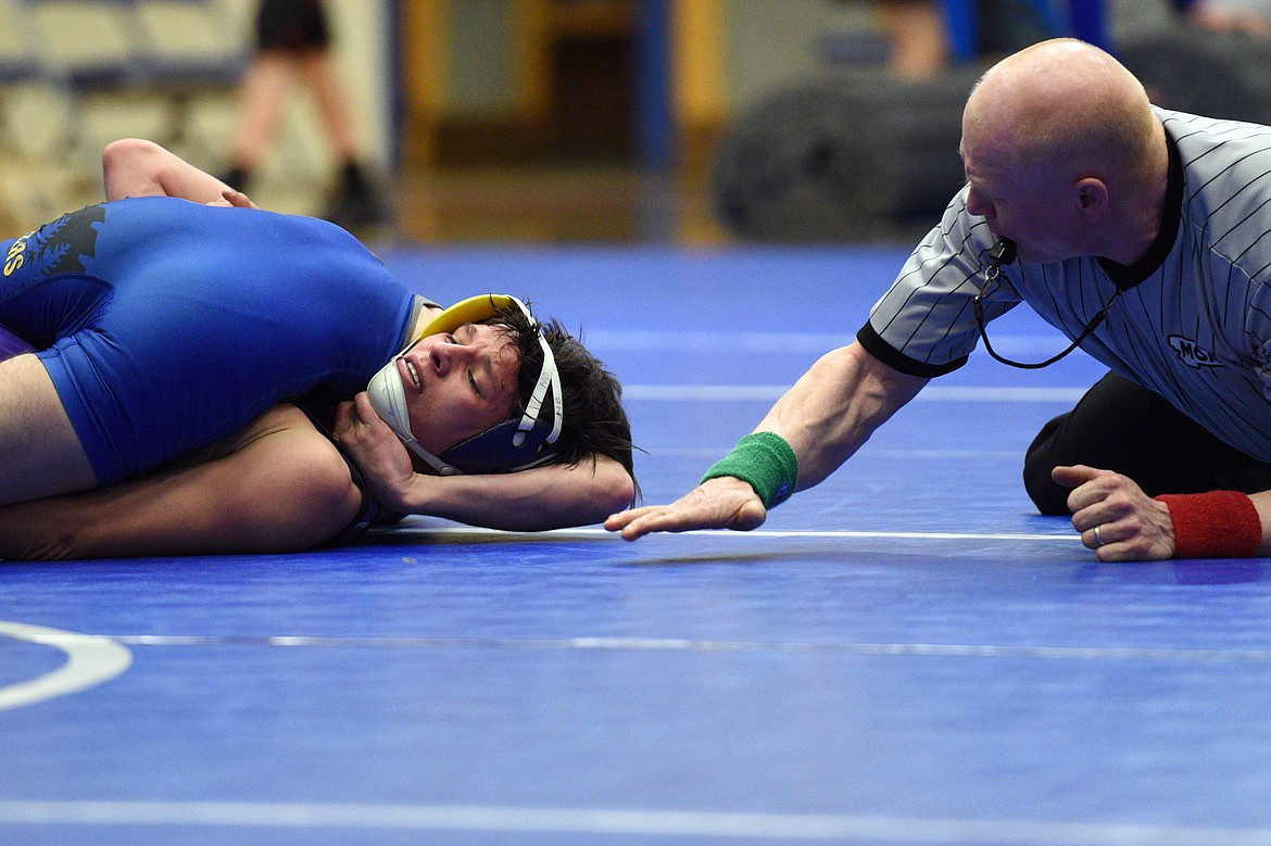 Libby&#146;s Buddy Doolin pins Polson&#146;s RJ PIerre at 113 pounds at Columbia Falls HIgh School on Tuesday. (Casey Kreider/Daily Inter Lake)