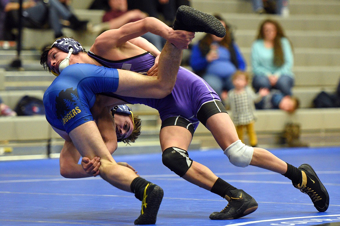 Polson&#146;s RJ Pierre wrestles Libby&#146;s Buddy Doolin at 113 pounds at Columbia Falls High School on Tuesday. Doolin won by pin. (Casey Kreider/Daily Inter Lake)