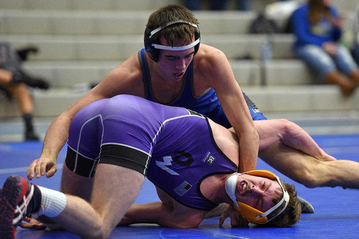 Libby&#146;s Jeff Offenbecher wrestles Polson&#146;s Jarod Farrier at 138 pounds at Columbia Falls High School on Tuesday. Offenbecher won by decision. (Casey Kreider/Daily Inter Lake)