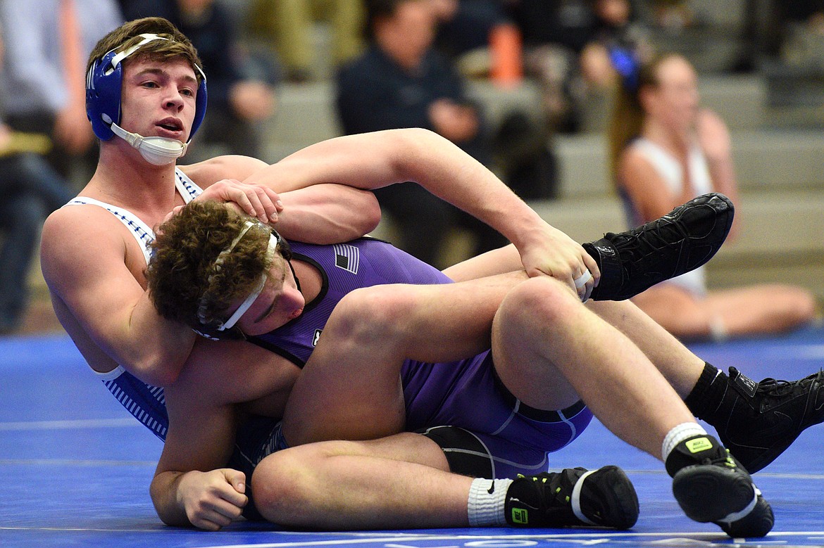 Columbia Falls&#146; Ben Windauer works toward a pin against Polson&#146;s Hunter Fritsch at 170 pounds on Tuesday. (Casey Kreider/Daily Inter Lake)