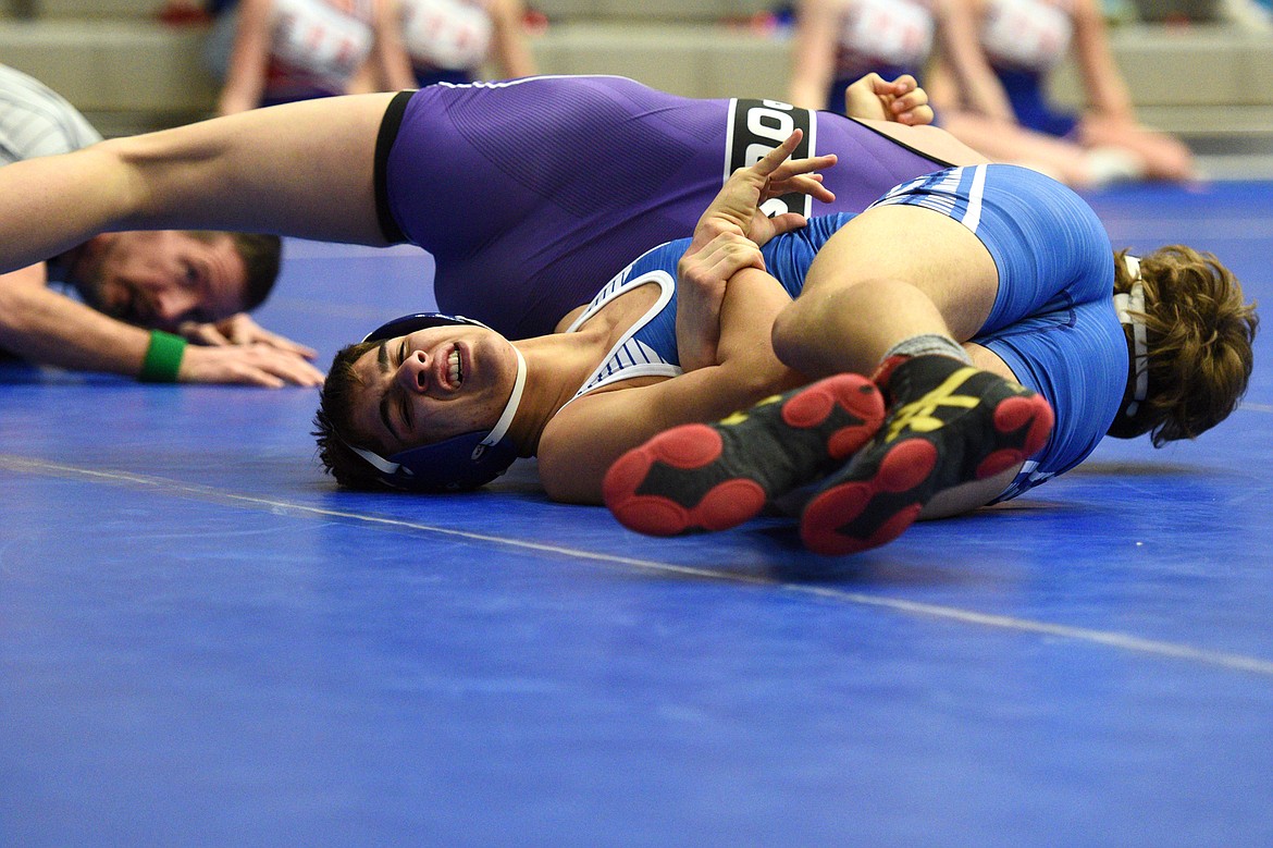 Polson&#146;s Parker Adler works toward a pin of Columbia Falls&#146; Isaac Balla at 152 pounds on Tuesday. (Casey Kreider/Daily Inter Lake)