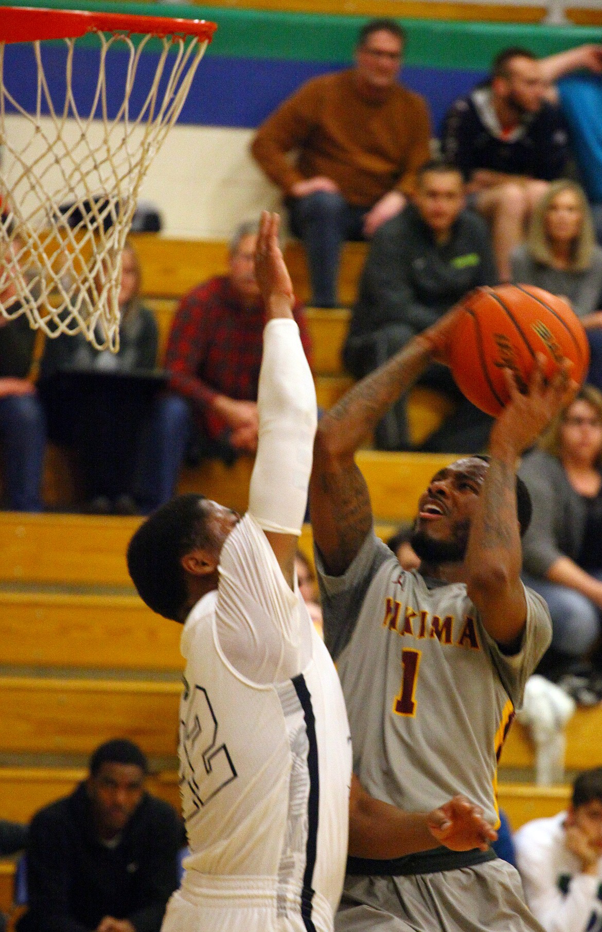 Rodney Harwood/Columbia Basin HeraldBig Bend freshman DeAngelo Stowers (22) defends against Yakima Valley's Gamayn Boykin (1) during the second half of Wednesday's NWAC East game at DeVries Activity Center.