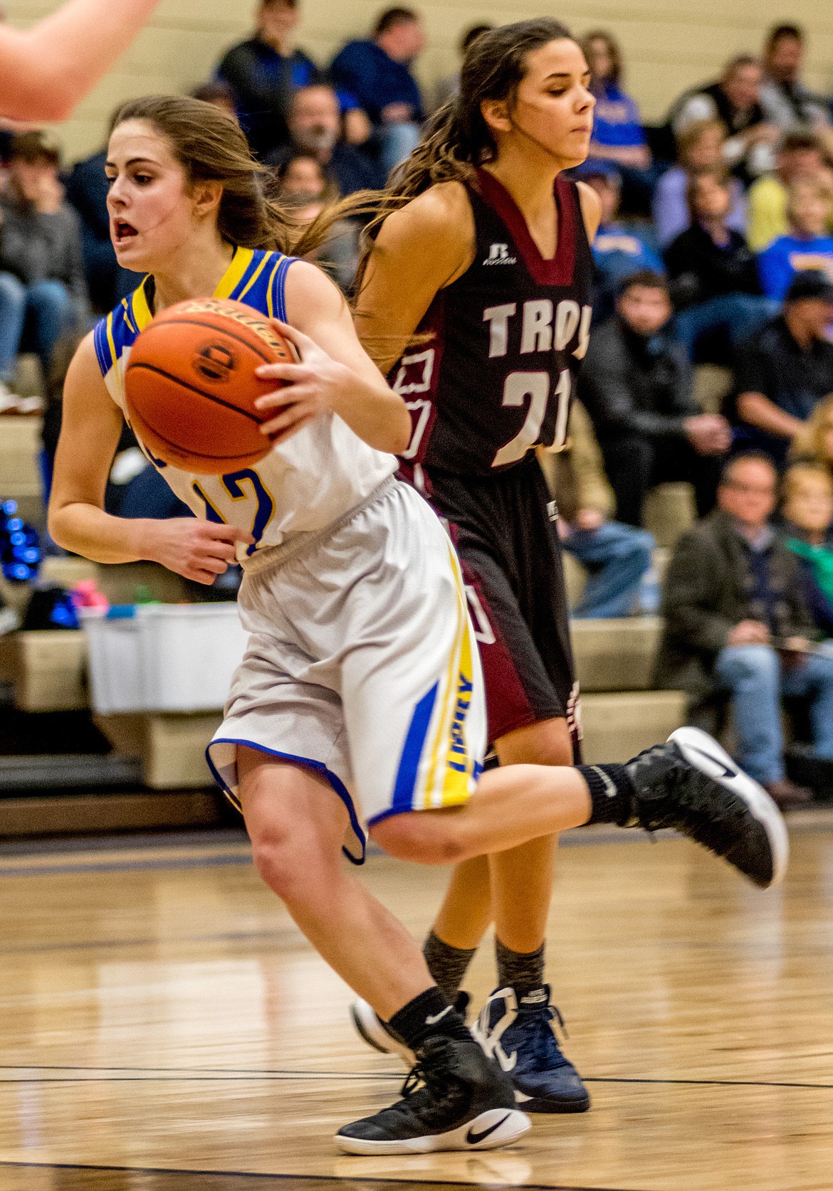 Libby&#146;s Alli Collins powers past Troy&#146;s Talise Becquart Thursday, Jan. 25. (John Blodgett/The Western News)