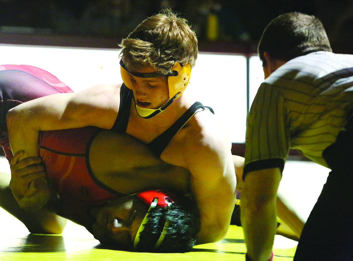 Connor Vanderweyst/Columbia Basin Herald
Moses Lake's Hunter Cruz works to pin Sunnyside's Alan Ochoa.