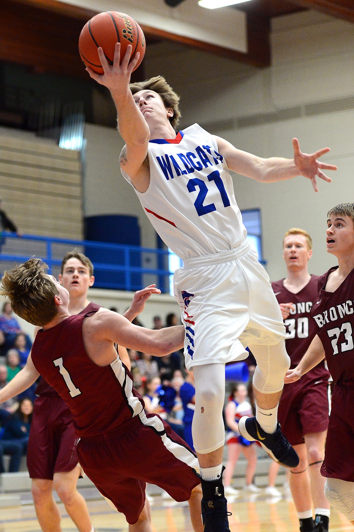 Columbia Falls&#146; Quintin Schriver drives to the hoop in the first quarter against Hamilton at Columbia Falls High School on Saturday. (Casey Kreider/Daily Inter Lake)