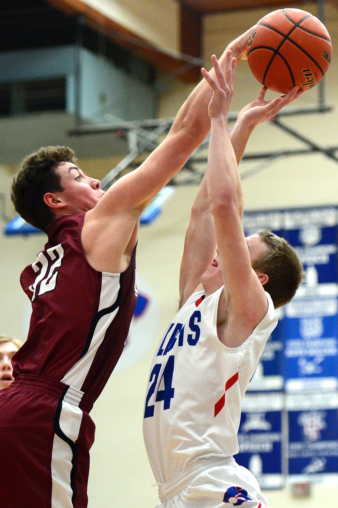 Columbia Falls&#146; Logan Bechtel has his shot blocked by Hamilton&#146;s Hunter Omlid at Columbia Falls High School on Saturday. (Casey Kreider/Daily Inter Lake)