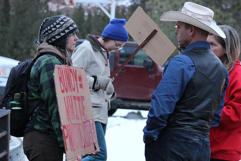 Rebecca Shoemaker, left, speaks with Ryan Bundy, right, before the Jan. 20 event in Paradise. (Patrick Reilly/Daily Inter Lake)